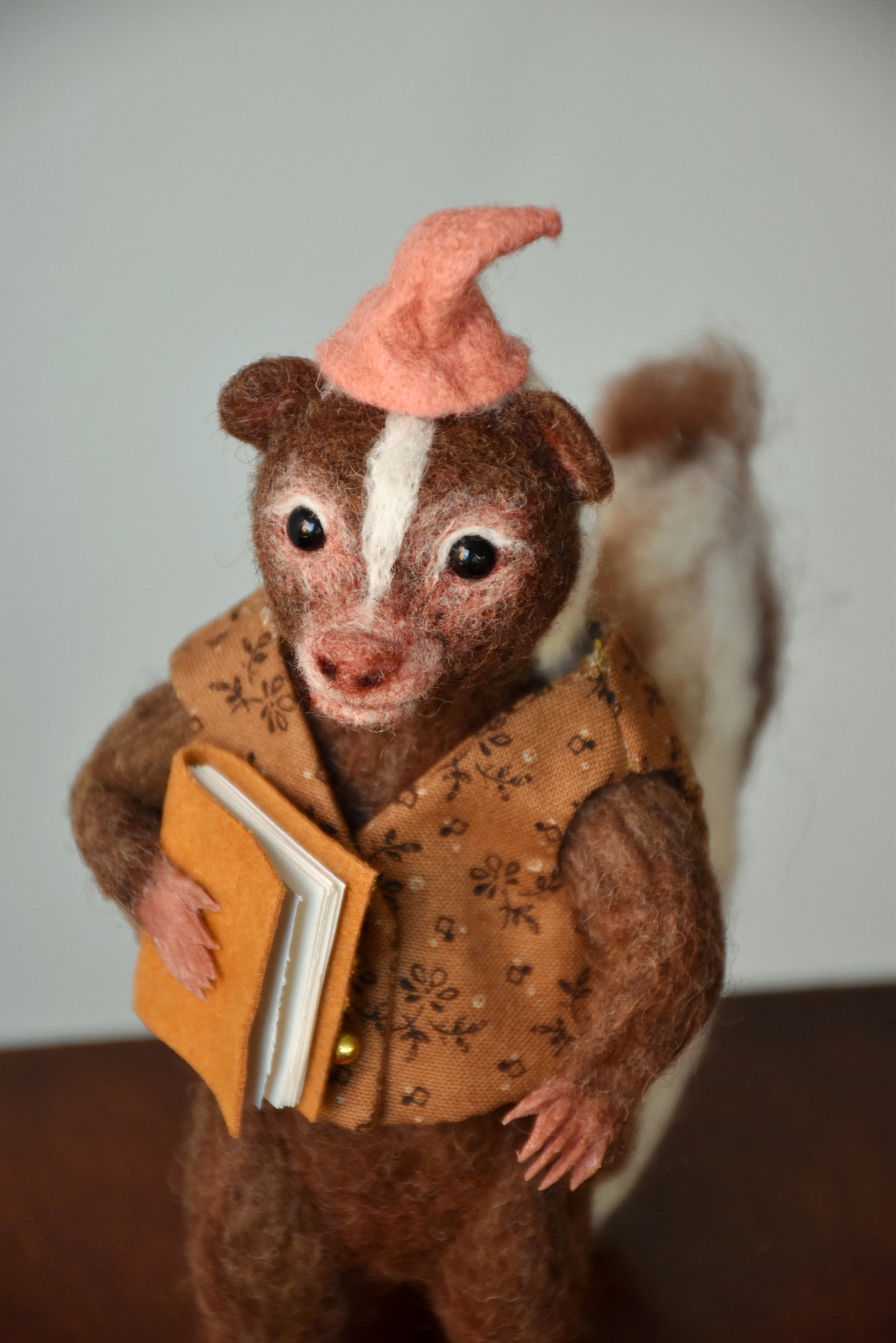 Needle Felted Wanderer Reader Brown Skunk